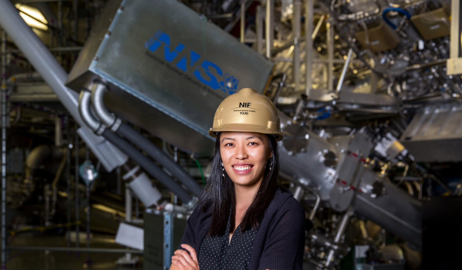 HEDS researcher Tammy Ma poses in front of the National Ignition Facility taregt chamber